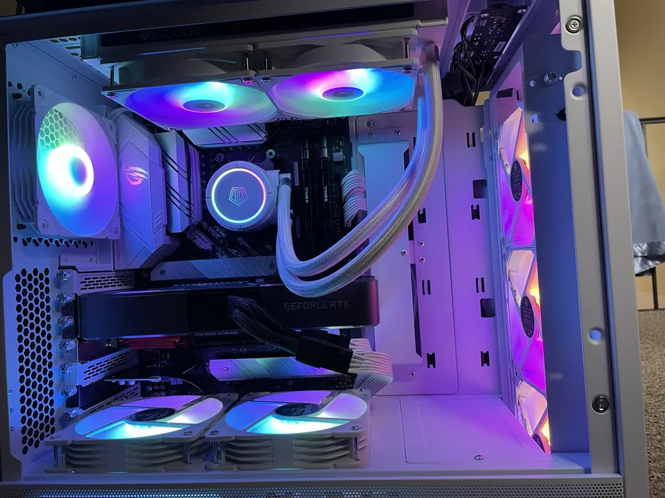 White custom gaming PC built by Foxworx with coordinated RGB lighting and cooling